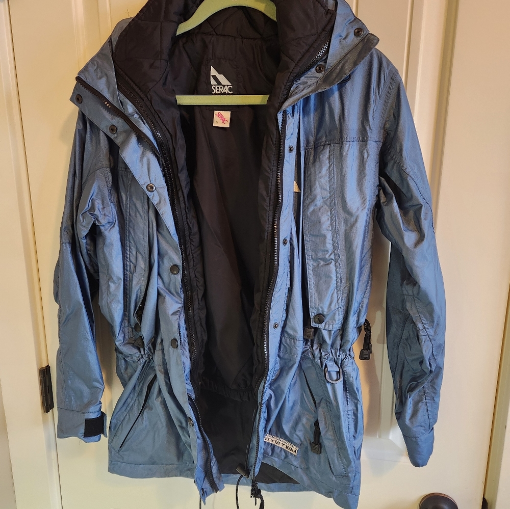 Serac brand size small color blue. Removable vest, adjustable cinch waist.